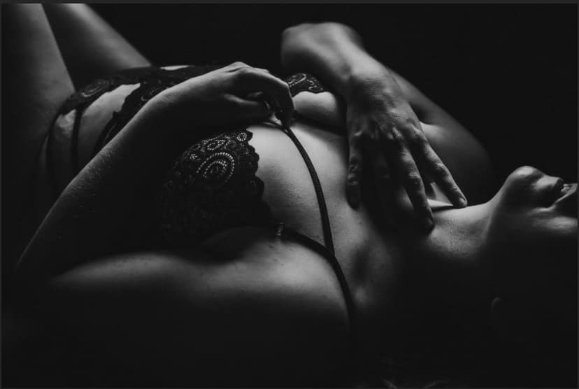 black and white boudoir detail image of a woman in the studio of Elevation Boudoir in Tuscaloosa AL