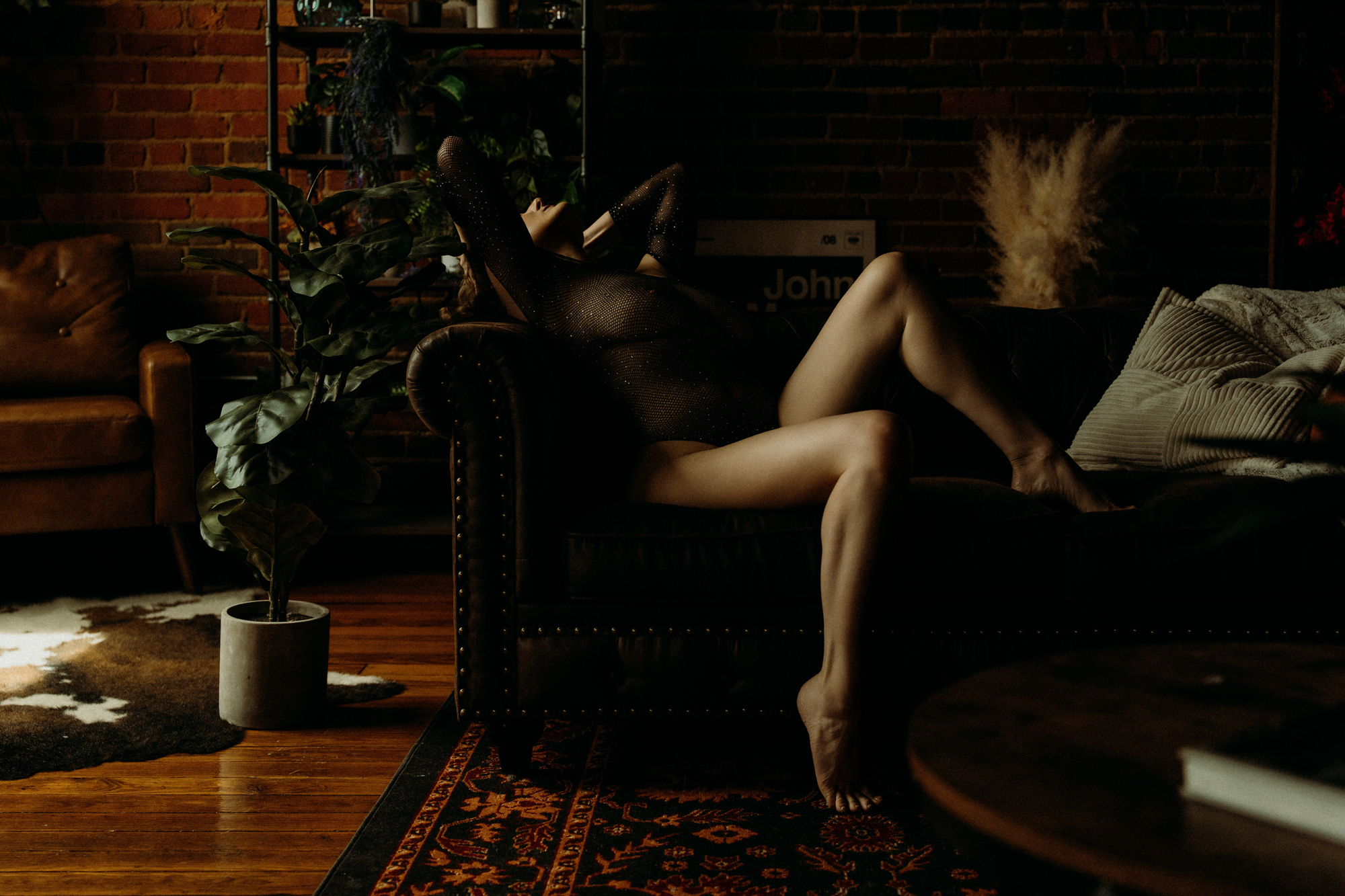 Woman posing confidently during boudoir photography session at Elevation Boudoir studio in Tuscaloosa Alabama