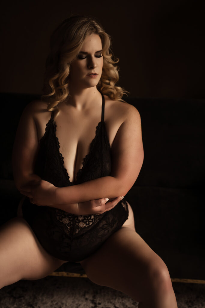 Gorgeous Blonde woman with dramatic boudoir makeup posing for boudoir